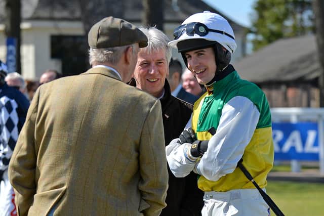 Ryan Mania talks to Harvey Smith and Mick Meagher, racing manager to Trevor Hemmings, in the colours of Vintage Clouds.
