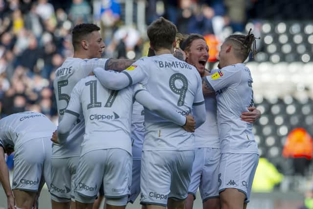 Luke Ayling, second from the right, celebrates opening the scoring with his Leeds United team-mates