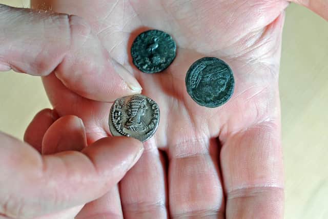 Artefacts such as ancient coins are stolen from historic grounds by illegal metal detectorists