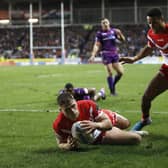 St Helens' Morgan Knowles goes over for a try against Huddersfield Giants.
