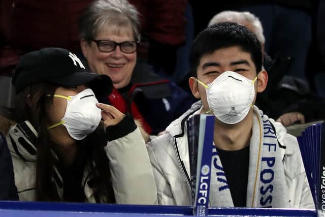 Football fans have been taking coronavirus precautions at Premier League, Football League and FA Cup games.
