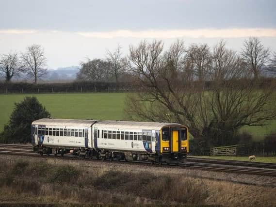 A Northern train rolls through the Yorkshire countryside.  Credit: PA