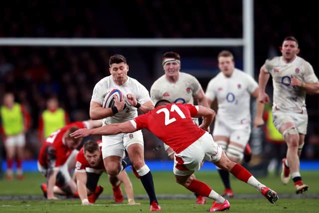 BRING IT ON: England's Ben Youngs runs at Wales' Rhys Webb at Twickenham. Picture: Adam Davy/PA