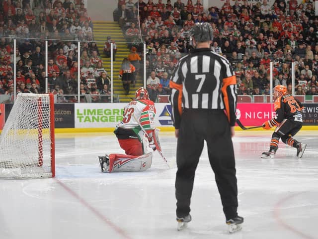 ON OUR WAY: Brendan Connolly fires past Ben Bowns on a penalty shot to make it 3-0 to Sheffield Steelers in the Challenge Cup Final. Picture: Dean Woolley.