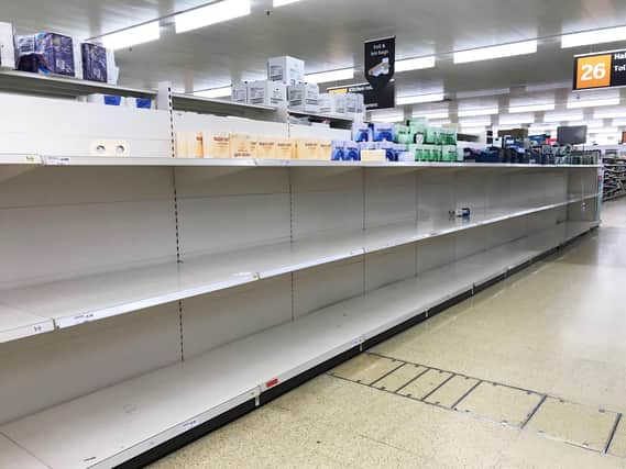 Empty toilet roll shelves in a Sainsbury's store  Picture: Andrew Matthews/PA Wire