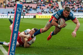 Hull KR's Greg Minikin goes over at Wigan Warriors but the 'try' is ruled out for a forward pass. (Alex Whitehead/SWpix.com)