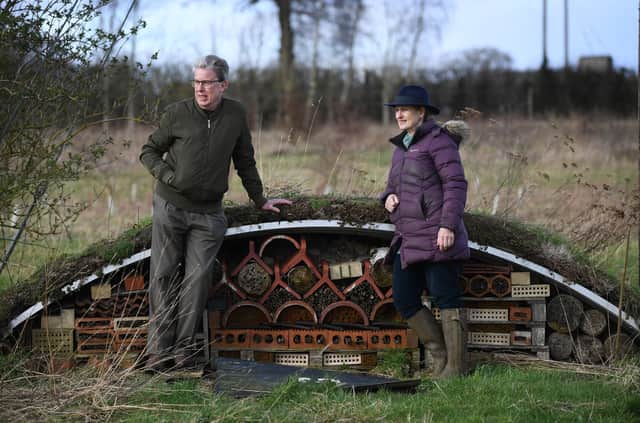 Nick Hall from Butterfly Conservation Yorkshire and Ros Forbes-Adams, pictured next to a bee house in the wood meadow at Three Hagges Wood near Escrick, which is part of the Escrick Park Estate.
 Picture Jonathan Gawthorpe