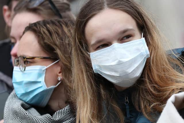 Spectators wearing masks to protect against coronavirus outside the Commonwealth Service at Westminster Abbey, London on Commonwealth Day.
Photo credit: Jonathan Brady/PA
