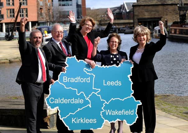 West Yorkshire council leaders celebrate the area's devolution deal.