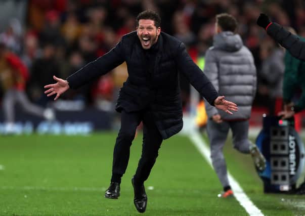 Mastermind: Diego Simeone races onto the pitch in jubilation after Marcos Llorente’s second goal drew Atletico Madrid level on the night and gave them a lead they would not relinquish as the Spanish side eliminated reigning champions Liverpool from the Champions League. (Picture: Peter Byrne/PA)