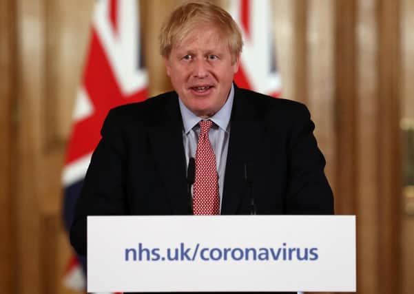 British Prime Minister Boris Johnson holds a news conference addressing the government's response to the coronavirus outbreak on March 12, 2020 in London, England. (Photo: Simon Dawson-WPA Pool/Getty Images)