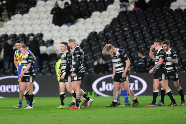 Disconsolate Hull FC players after their abysmal 38-4 home defeat to Warrington. (PIC: STEVE RIDING)