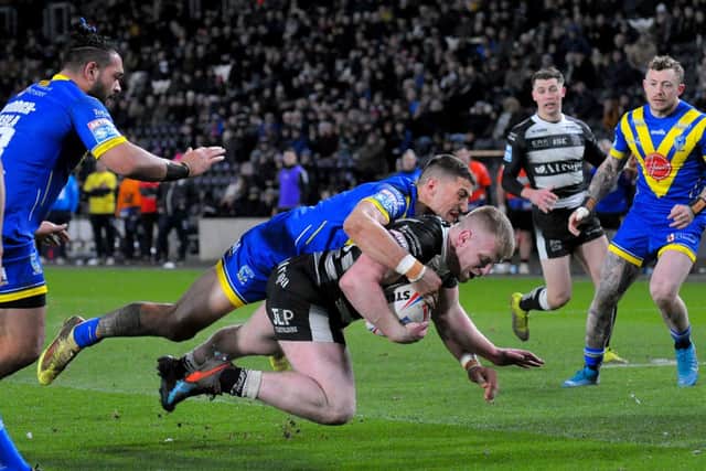 Hull FC's Brad Fash is brought down. (PIC: STEVE RIDING)