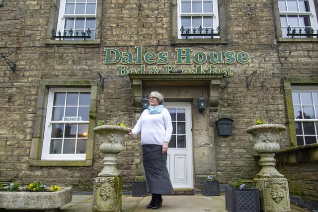 Nina Wilson, 71, stands outside her business, the Dales House Bed and Breakfast in Hawes. Photo credit: Tony Johnson
