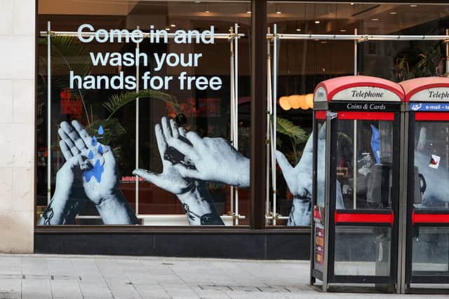 A sign in the window of a Lush store in Liverpool offering a free hand wash service. PA Photo. Picture: Peter Byrne/PA Wire