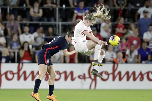 Bright spot: England's Lauren Hemp, right, collides with United States' Kelley O'Hara, left. (AP Photo/John Raoux)