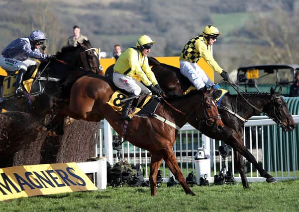 Al Boum Photo ridden by Paul Townend (right) jumps the last on the way to winning the Magners Cheltenham Gold Cup Chase.