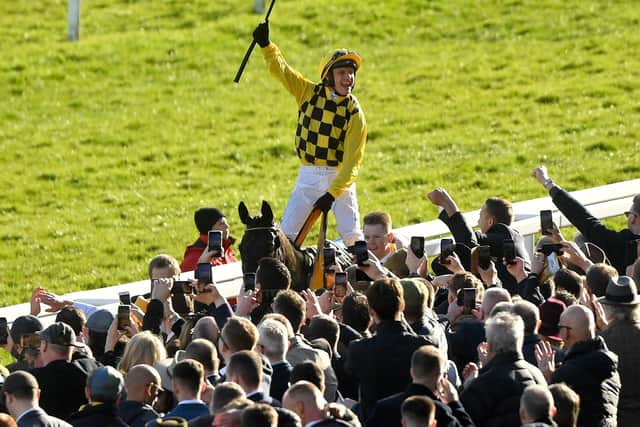 Jockey Paul Townend celebrates on Al Boum Photo after winning the Magners Cheltenham Gold Cup Chase during day four of the Cheltenham Festival at Cheltenham Racecourse.