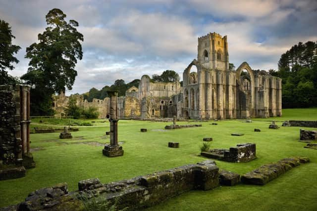 A view towards the east end of the Abbey church showing the great east window arch at Fountains Abbey, North Yorkshire.
