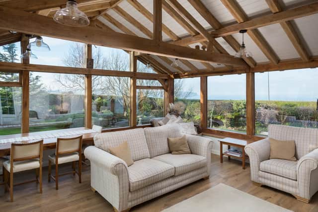The green-oak frame garden room with exceptional sea views