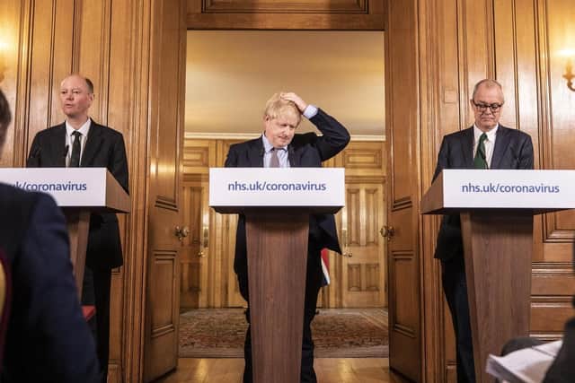 Chief Medical Officer for England Chris Whitty (left) and Chief Scientific Adviser Sir Patrick Vallance stand with Prime Minister Boris Johnson during a media briefing in Downing Street, London, on Coronavirus (COVID-19) after the government's COBRA meeting. Photo: PA