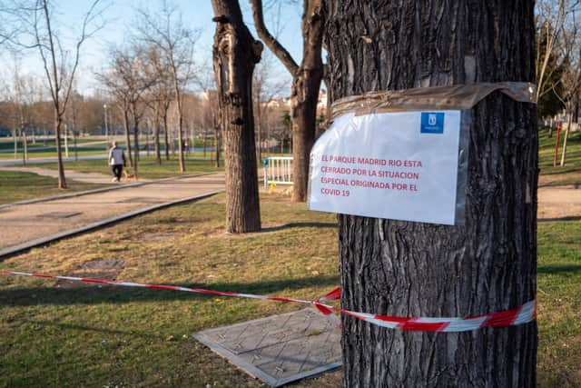 Police barricade tape has appeared over the weekend in Madrid forbidding people to enter public parks. Photo credit: James Dacey