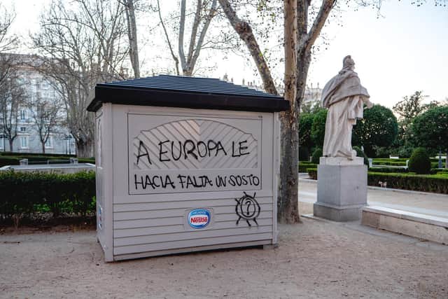 Fresh graffiti on a closed kiosk saying Europe needed a scare. Photo credit: James Dacey
