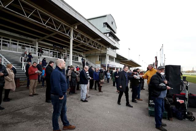 Racegoers place bets with bookmakers at Southwell Racecourse. on Monday. Picture: Tim Goode/PA