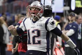 New England Patriots' Tom Brady (12) screams as he enters the stadium before the NFL Super Bowl 53 football game between the Los Angeles Rams and the New England Patriots Sunday, Feb. 3, 2019, in Atlanta. (AP Photo/Lynne Stadky)