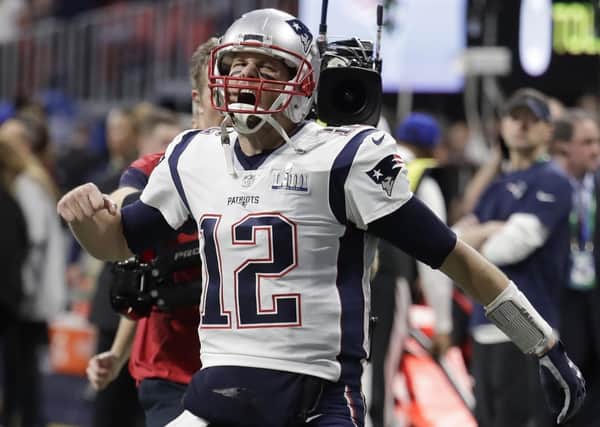 New England Patriots' Tom Brady (12) screams as he enters the stadium before the NFL Super Bowl 53 football game between the Los Angeles Rams and the New England Patriots Sunday, Feb. 3, 2019, in Atlanta. (AP Photo/Lynne Stadky)