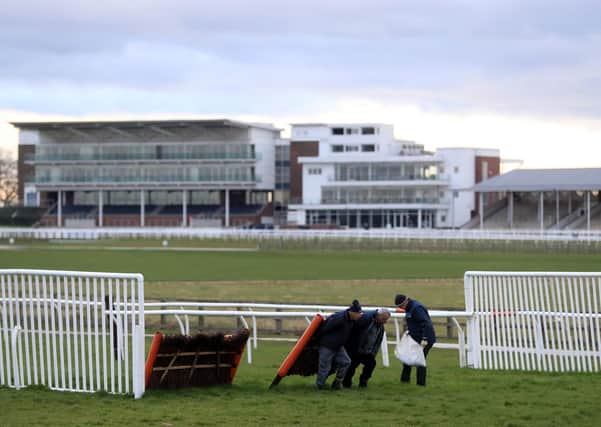 Hurdles are removed from a desolate Wetherby after Tuesday's meeting - the last before the sport's suspension.