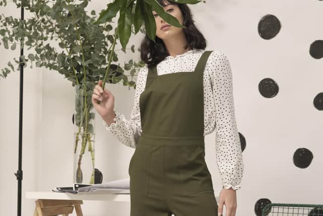 HOME WORKING ESSENTIALS - 
THE EASY DUNGAREES: With their chic utility styling details, jumpsuits and all-in-ones really come into their own for home-working, not least because, when you need the loo, the only bathroom floor to worry about as you take it off is your own.
 Oliver Bonas polka dot blouse, £49.50; khaki button back jumpsuit, £75; flatform leather trainer, £69.50. All at OliverBonas.com.
