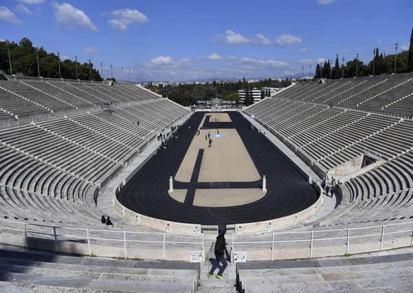 Deserted: Empty tribunes are seen during the Olympic flame handover ceremony for the 2020 Tokyo Summer Olympics, in Athens. The ceremony was held behind closed doors and with the presence of few members of the media because of fears over coronavirus. Picture: AP