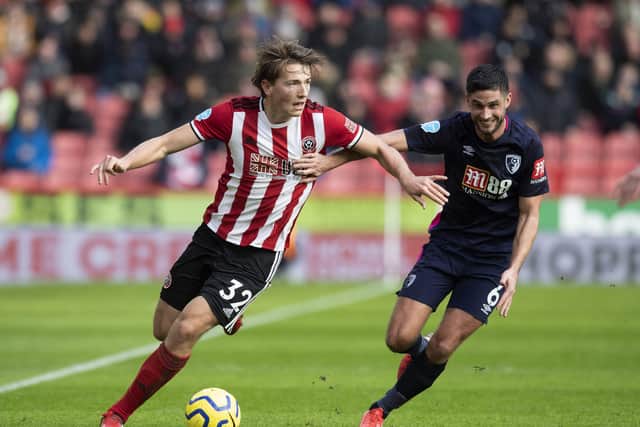 HELPING HAND: Sheffield United's Sander Berge battles with Bournemouth's Andrew Surman at Bramall Lane. Picture: Simon Bellis/Sportimage