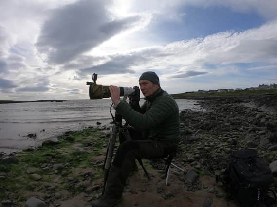 Robert Fuller taking pictures of the Oystercatchers in Caster