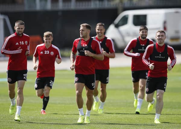 Captain Billy Sharp of Sheffield Utd leads the players in a warm up.  Picture: Simon Bellis/Sportimage