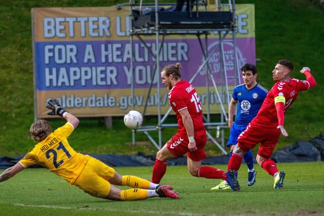Jack Redshaw's shot is saved by Jordan Holmes as 
FC Halifax Town faced Ebbsfleet United in National League at The Shay last weekend before falling into line with the bigger clubs on Monday.  Picture: Bruce Rollinson