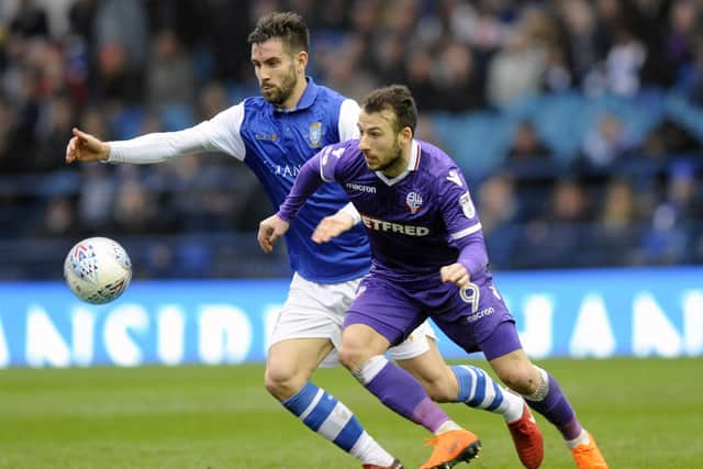 FAMILIAR FACE: Adam Le Fondre battles with Sheffield Wednesday's Frederico Venancio while playing for Bolton. Picture: Steve Ellis.