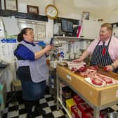 The couple film Philip in his Howden butcher's shop