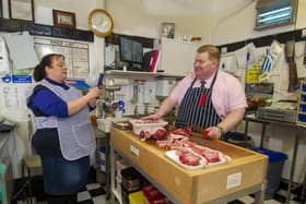The couple film Philip in his Howden butcher's shop