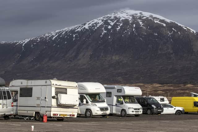 Campervans parked up in Glencoe, Argyll and Bute. PA Photo. Picture date: Sunday March 22, 2020. The Scottish Government has issued a travel warning and criticised the '"irresponsible behaviour" of those travelling to the Highlands in a bid to isolate from coronavirus. See PA story HEALTH Coronavirus. Photo credit should read: Jane Barlow/PA Wire