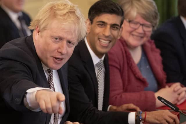 Boris Johnson alongside Rishi Sunak, the Chancellor, in Cabinet.