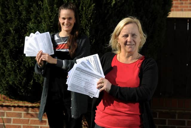 Annie Kirkman, left, and Jackie Heffer, founders of the Beverley and East Riding Covid-19 Mutual Aid Group pictured with the leaflets. Picture: Simon Hulme