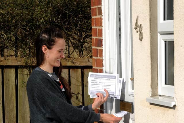 Annie Kirkman posts the leaflets offering help in Beverley. Picture: Simon Hulme