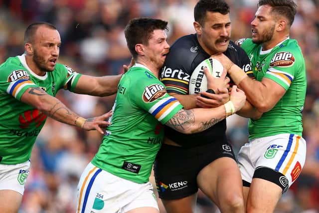 Penrith Panthers' Reagan Campbell-Gillard is smothered by Canberra Raiders' duo John Bateman, left, and Aidan Sezer in their NRL clash at Panthers Stadium in July last year. Picture: Jason McCawley/Getty Images