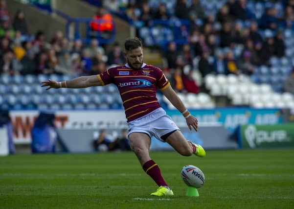 SUDDEN IMPACT: Huddersfield Giants' Aidan Sezer kicks the conversion from the first try.   Picture: Tony Johnson.