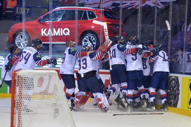 Great Britain's players celebrate Ben Davies's overtime winner against France at last year's world championships. Picture: Dean Woolley.