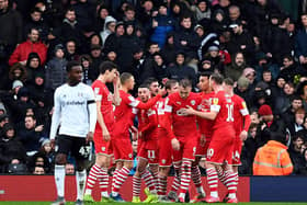 Barnsley's  Cauley Woodrow (centre) celebrates scoring from the penalty spot against Fulham at Craven Cottage. Picture: Victoria Jones/PA