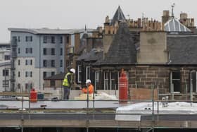 Construction workers in Edinburgh the day after Prime Minister Boris Johnson put the UK in lockdown to help curb the spread of the coronavirus. Picture: Jane Barlow/PA Wire