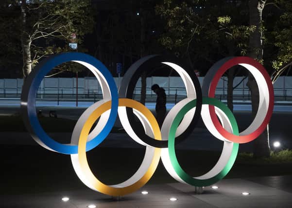IOC President Thomas Bach has agreed "100%" to a proposal of postponing the Tokyo Olympics for about one year until 2021 because of the coronavirus outbreak, Japanese Prime Minister Shinzo Abe said Tuesday. (AP Photo/Jae C. Hong)